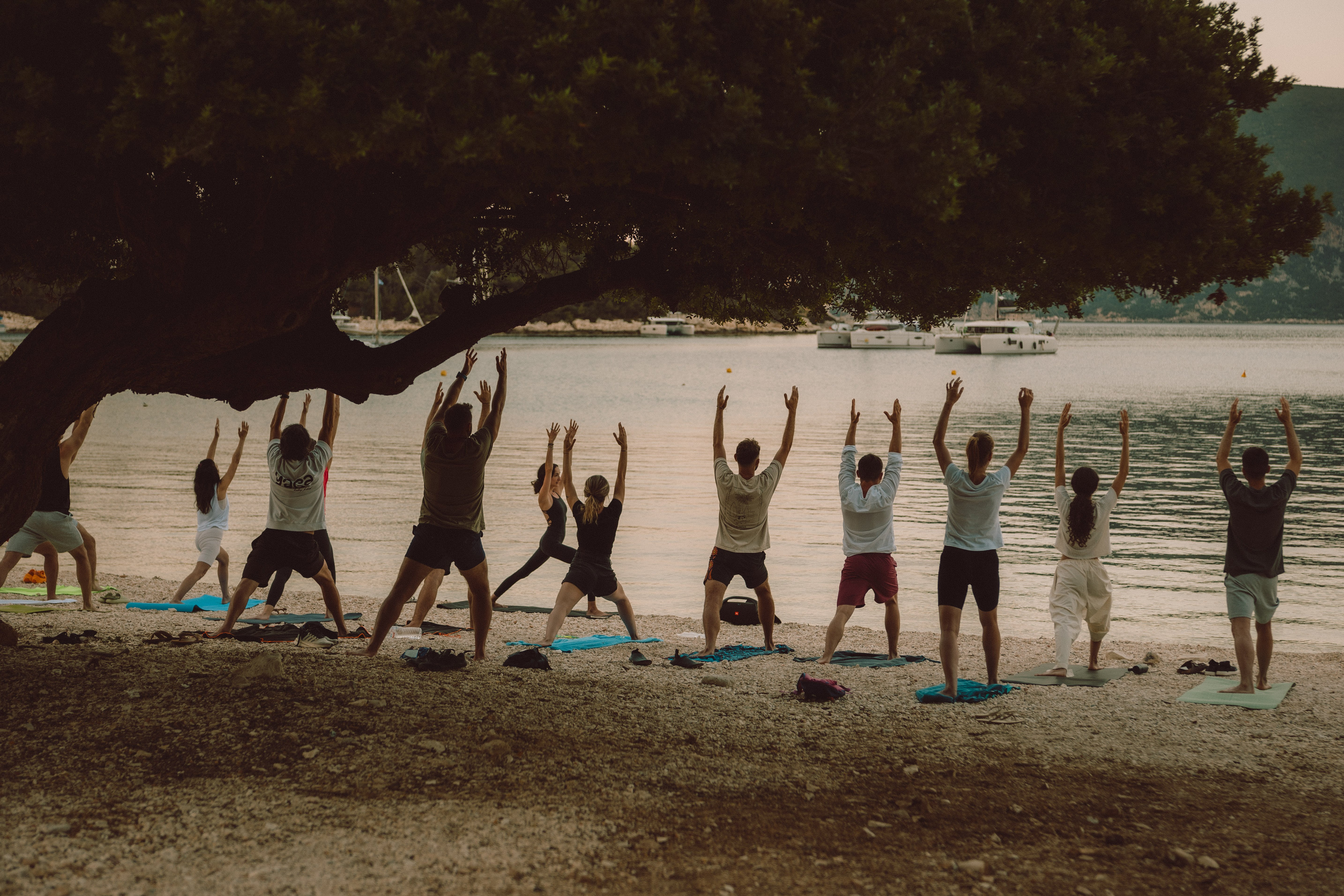 Group yoga on beach