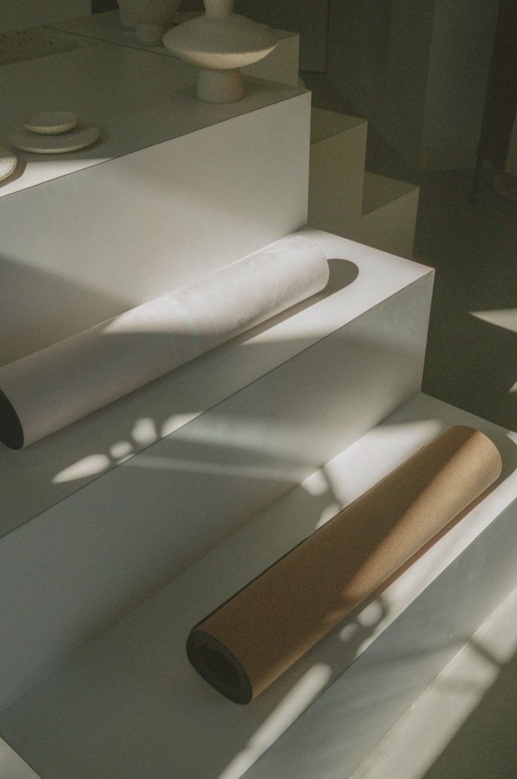 Cork Yoga Mat displayed on minimalist white steps with soft shadows